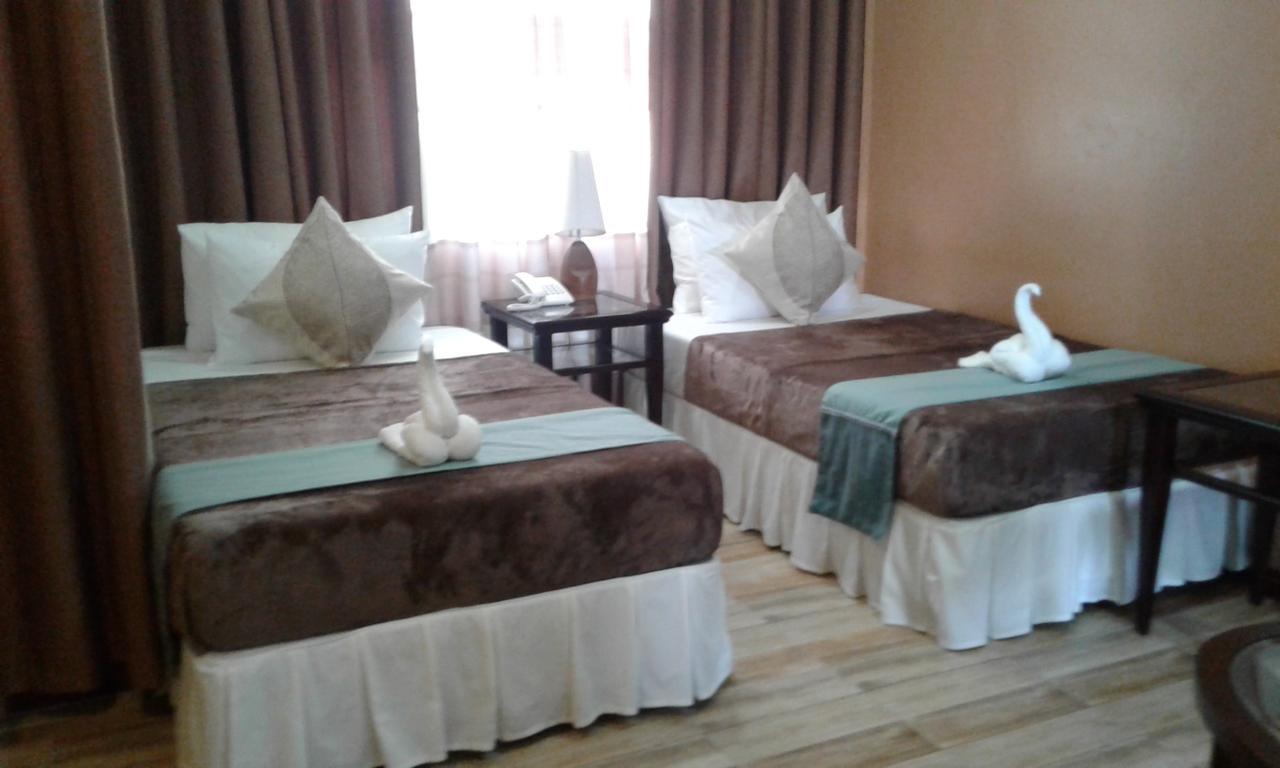 Charos Dormitel Hotell Dumaguete City Exteriör bild
