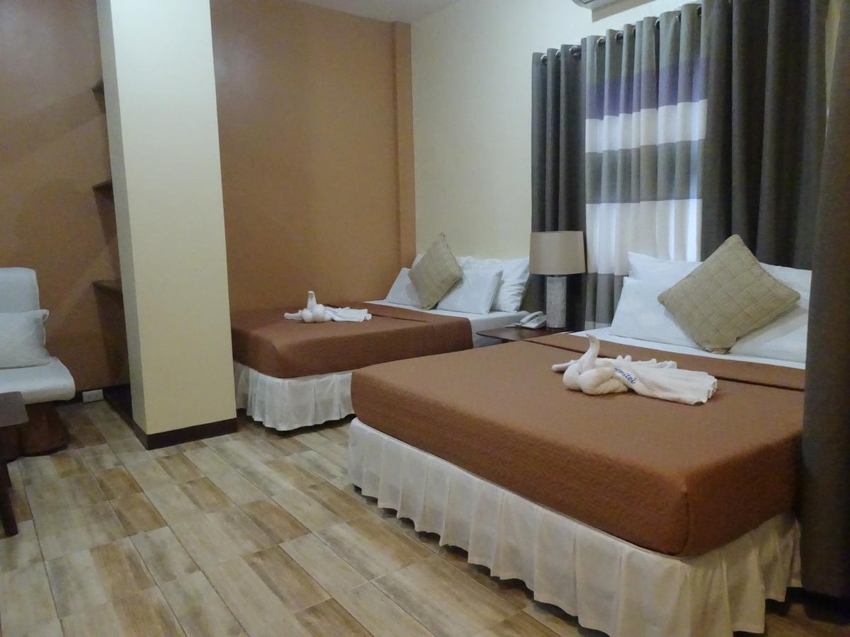 Charos Dormitel Hotell Dumaguete City Exteriör bild